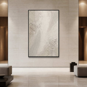 Textured white Wabi Sabi wall art displayed in an upscale hotel lobby.