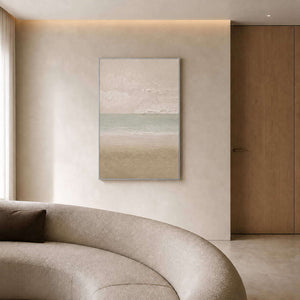 Textured horizon canvas above a curved sofa in an ivory sitting room.
