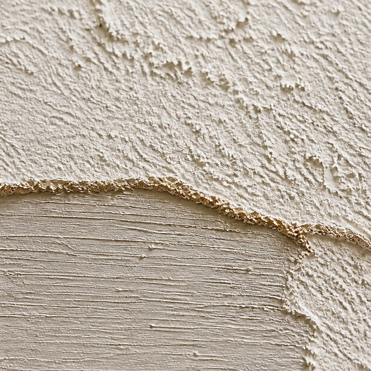 Close-up of raised ivory texture and softly brushed greige passages.