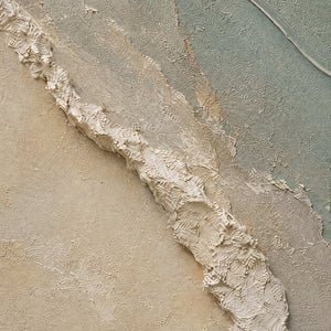 Close-up of raised white texture sage paint cream layers and gold seams.