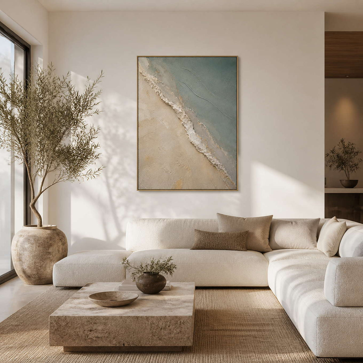 Sage coastal wall art displayed in a warm white modern living room.