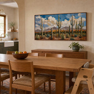 Saguaro landscape wall art displayed in a warm wood dining room.