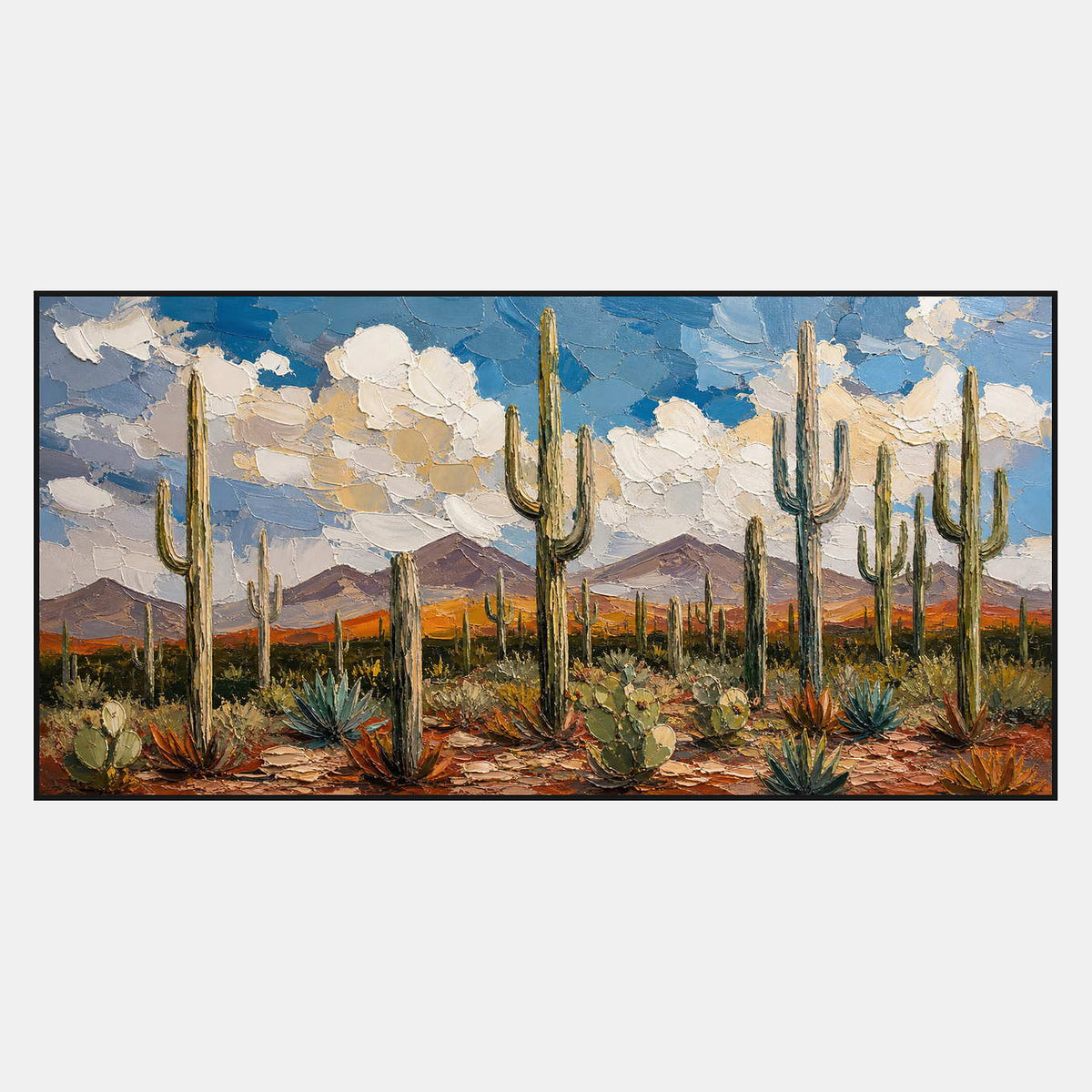 Textured desert wall art with saguaros, agave, mountains, and blue sky.