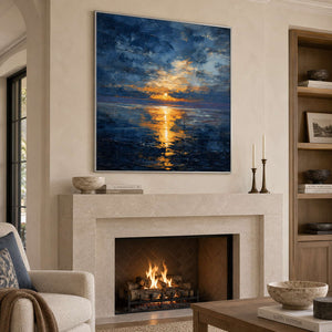 Angled view of the blue and golden seascape above a pale stone fireplace.