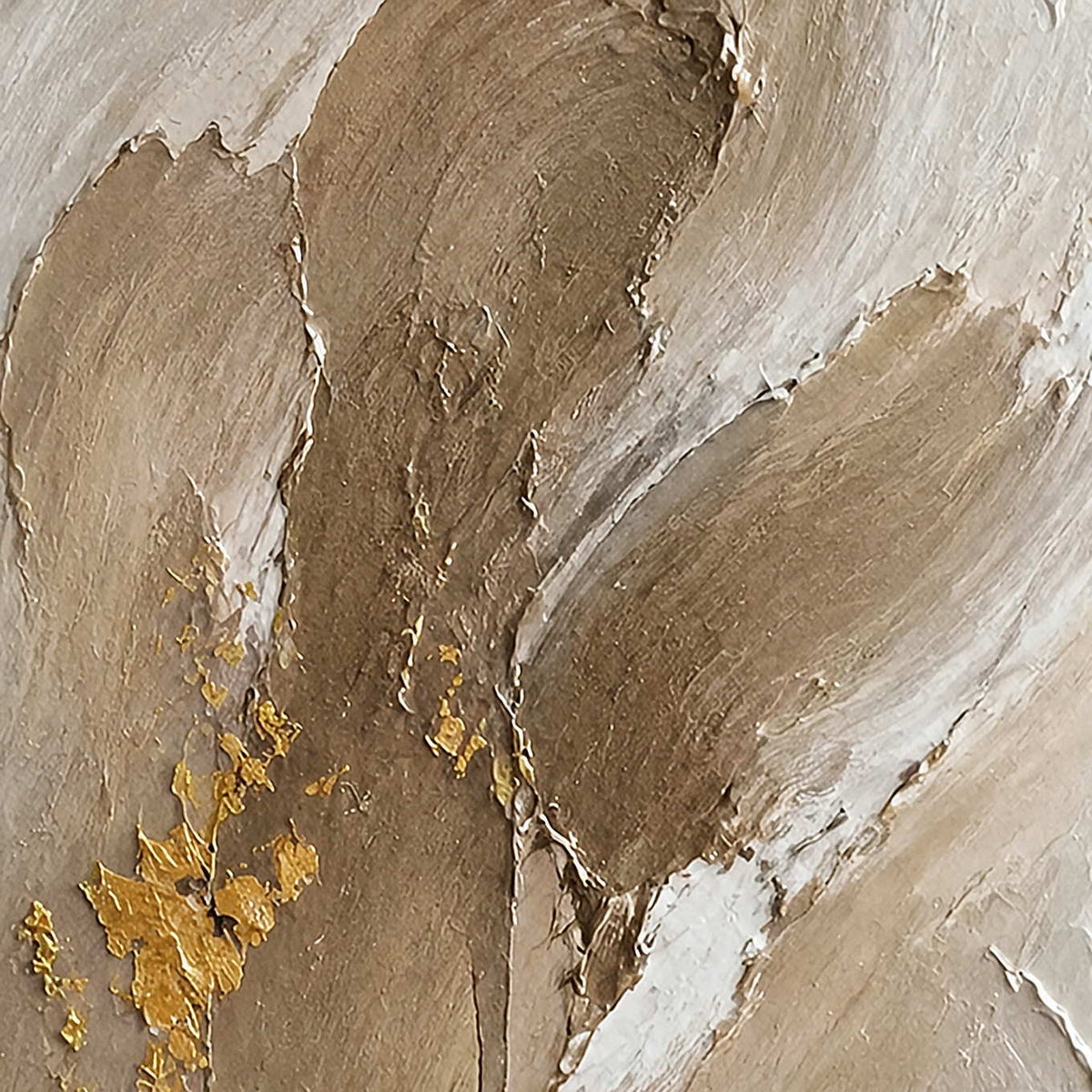 Close-up of raised taupe, ivory, stone, and gold plaster-like texture.