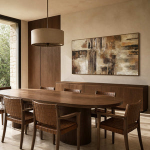 Textured abstract wall art displayed in a warm wood dining room.