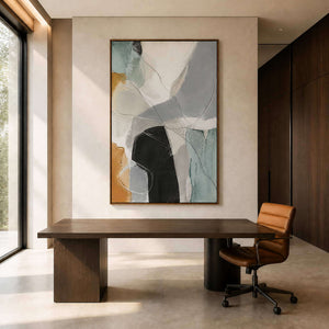 Textured geometric wall art above a refined dark wood office desk.