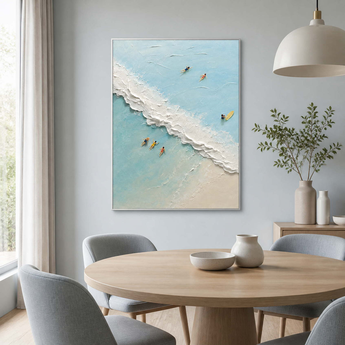 Turquoise beach wall art displayed in a light gray-blue modern dining room.