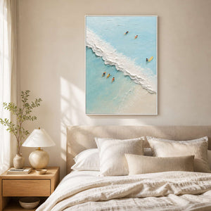 Serene aerial beach artwork displayed in a warm beige bedroom.