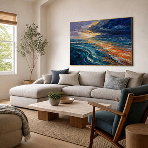 Blue and orange textured ocean wall art displayed in a coastal modern living room.