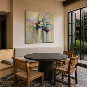 Square abstract painting brightens a garden-facing modern breakfast room.