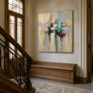 Textured pastel abstract artwork displayed beside an art nouveau staircase.