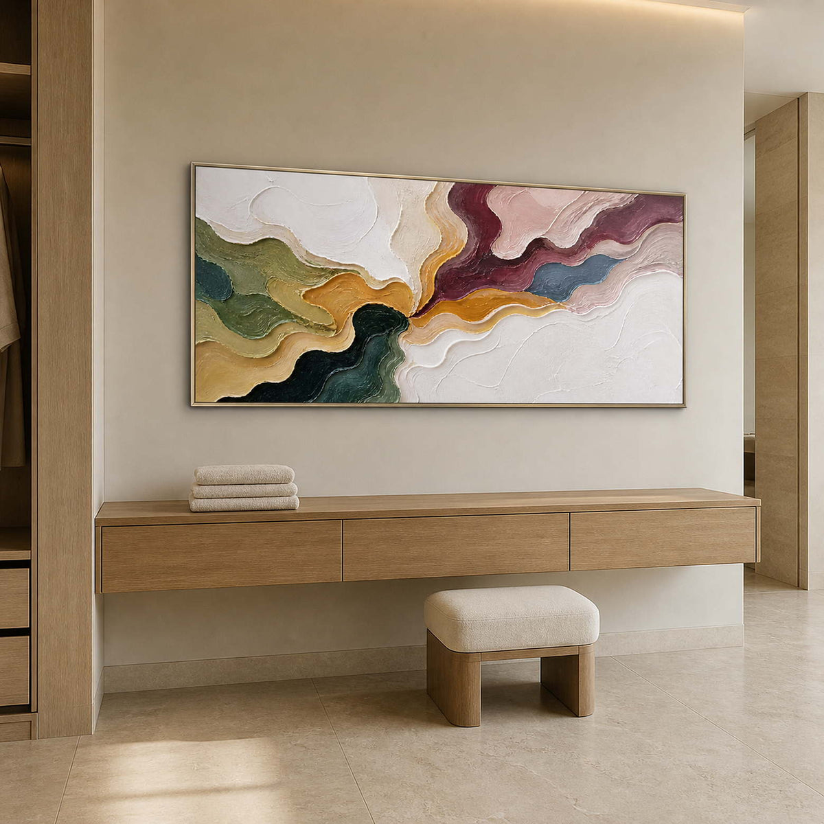 Textured abstract canvas above a bright bathroom dressing console.
