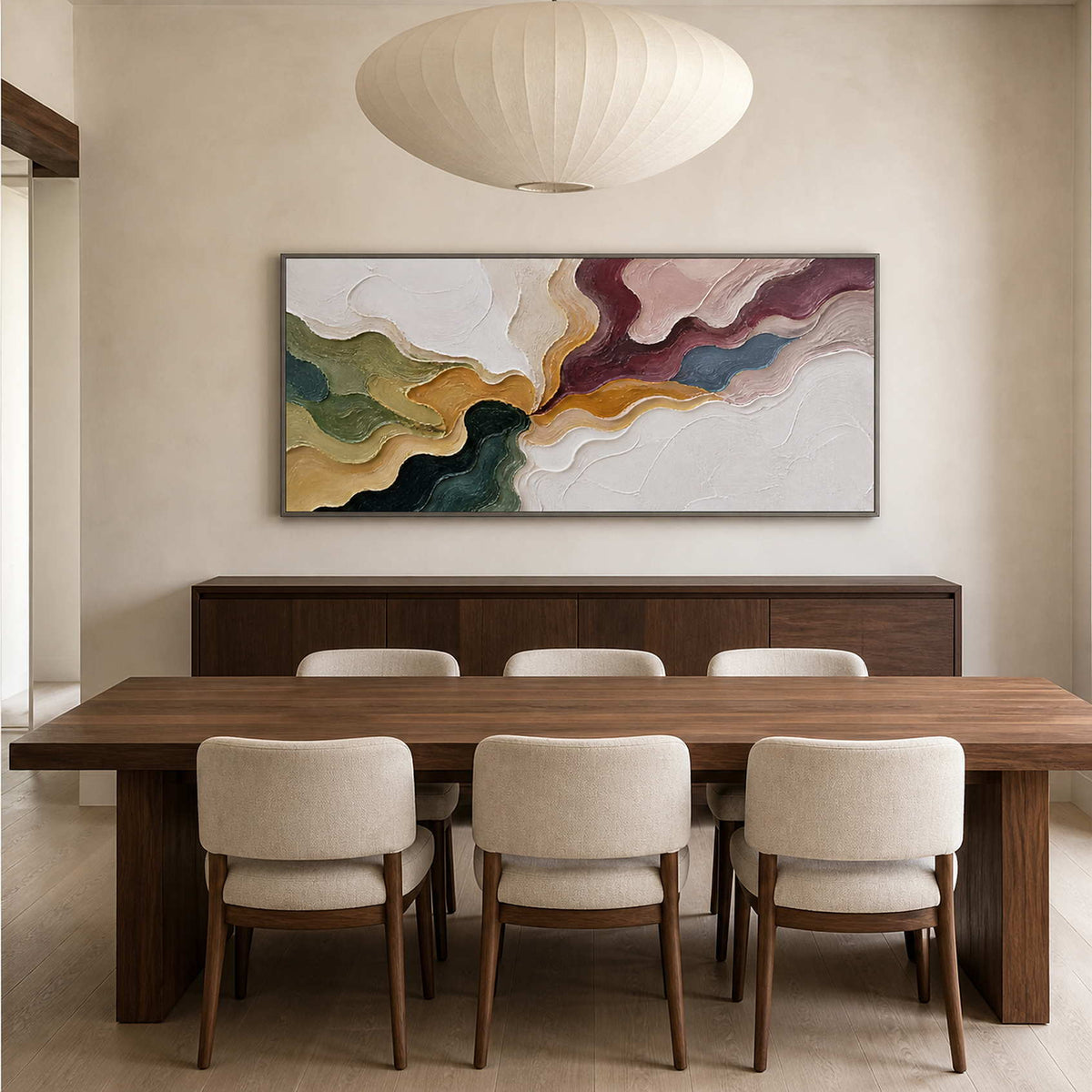 Textured multicolor abstract artwork above a deep walnut dining table.