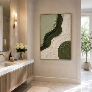 Olive textured wall art in a serene bathroom space.