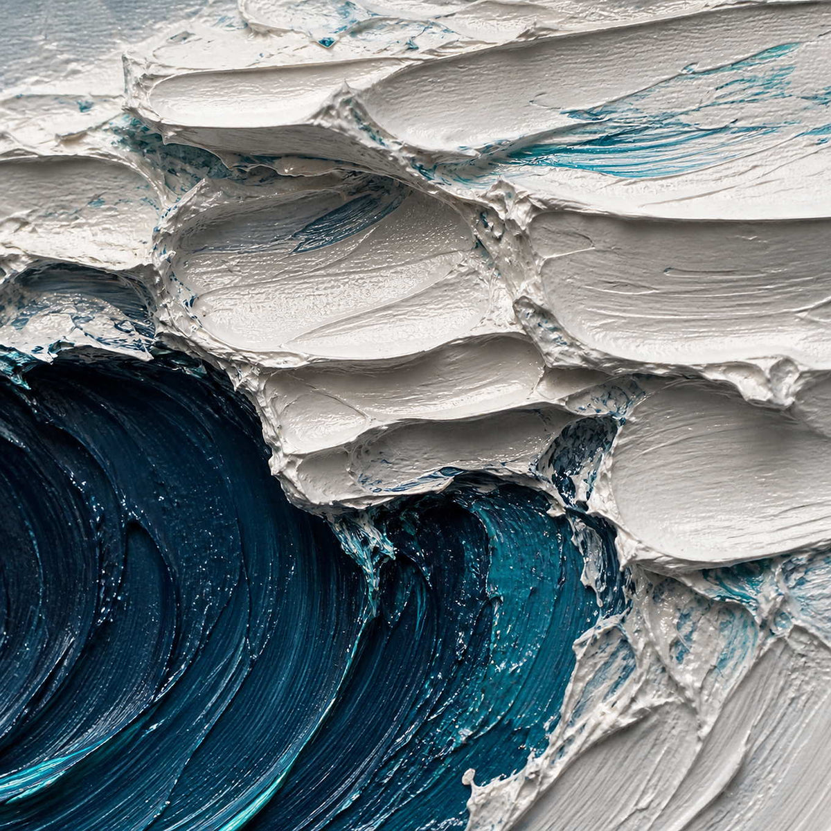 Close-up of thick white foam and deep teal palette-knife texture.