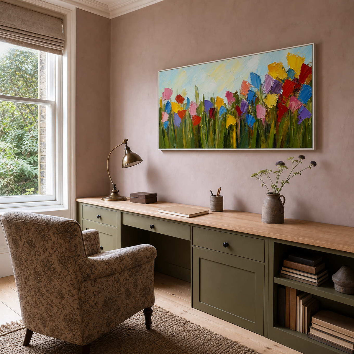 Colorful floral wall art displayed above a quiet home office desk.