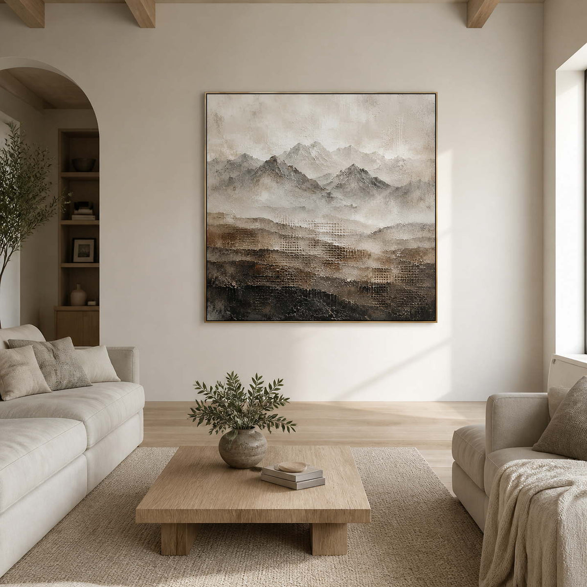 Textured neutral mountain wall art displayed in a warm gray living room.