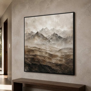Square mountain landscape wall art shown from the side in a gray-brown stone corridor.