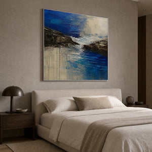 Square blue coastal wall art above a warm minimalist bedroom.