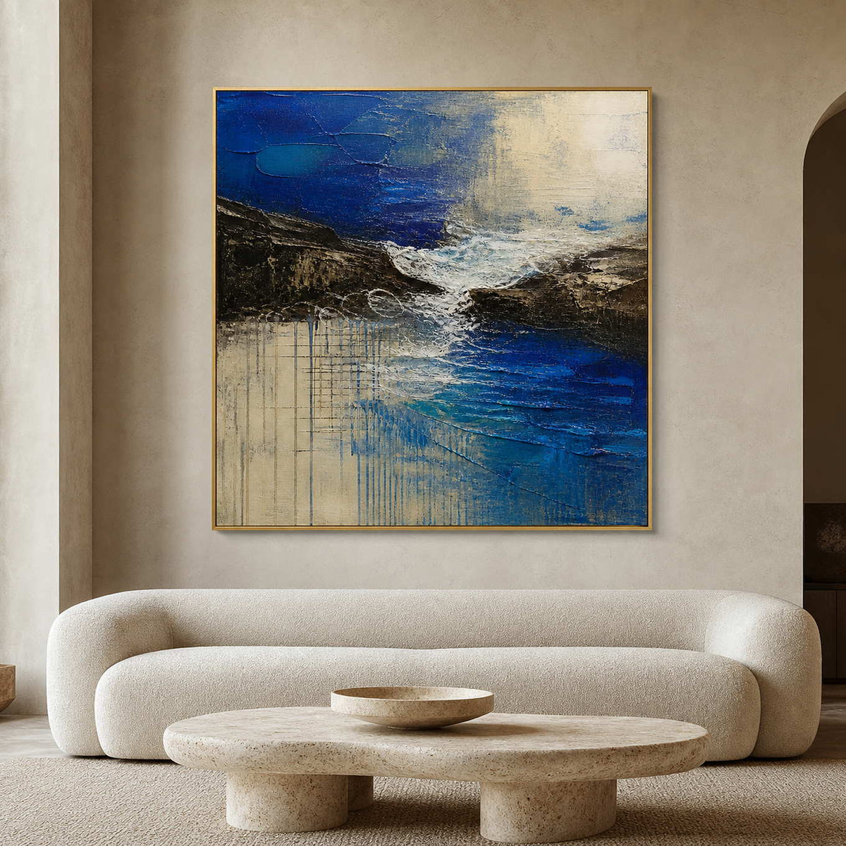 Blue textured coastal wall art above a cream modern living room.