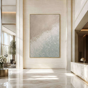 Textured coastal wall art displayed in a quiet hotel lobby.