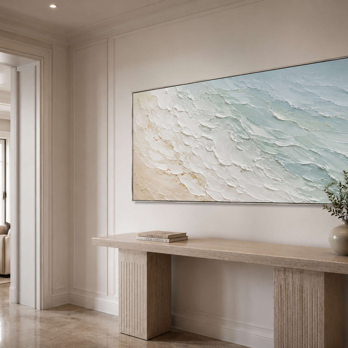 Panoramic coastal canvas bringing airy color to a neutral entryway.