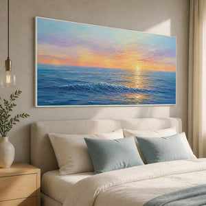 Serene turquoise and peach ocean artwork displayed in a luxury bedroom.