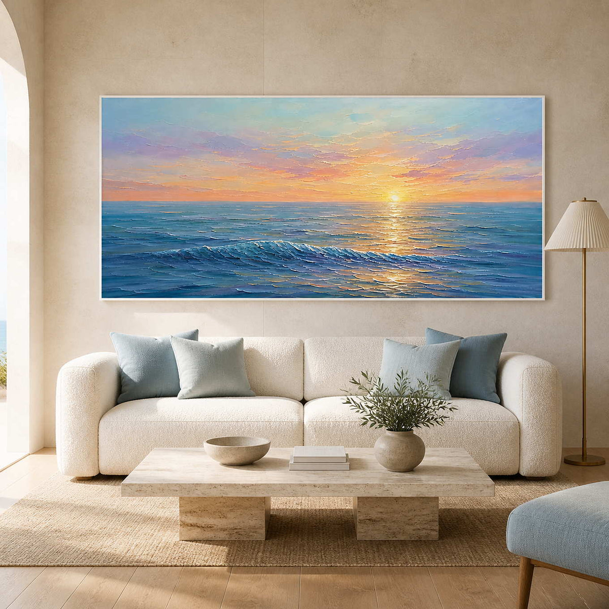 Textured sunset ocean wall art displayed in a bright coastal living room.