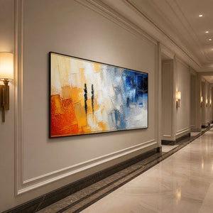 Orange and cobalt textured wall art stretches across an elegant hallway.