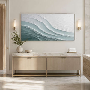 Textured ocean wall art in a quiet modern bathroom