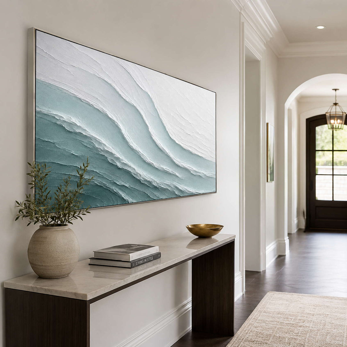 Wide coastal abstract artwork in a refined residential hallway