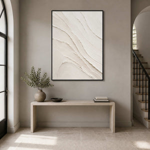 Textured white minimalist wall art displayed in a warm gray entryway.