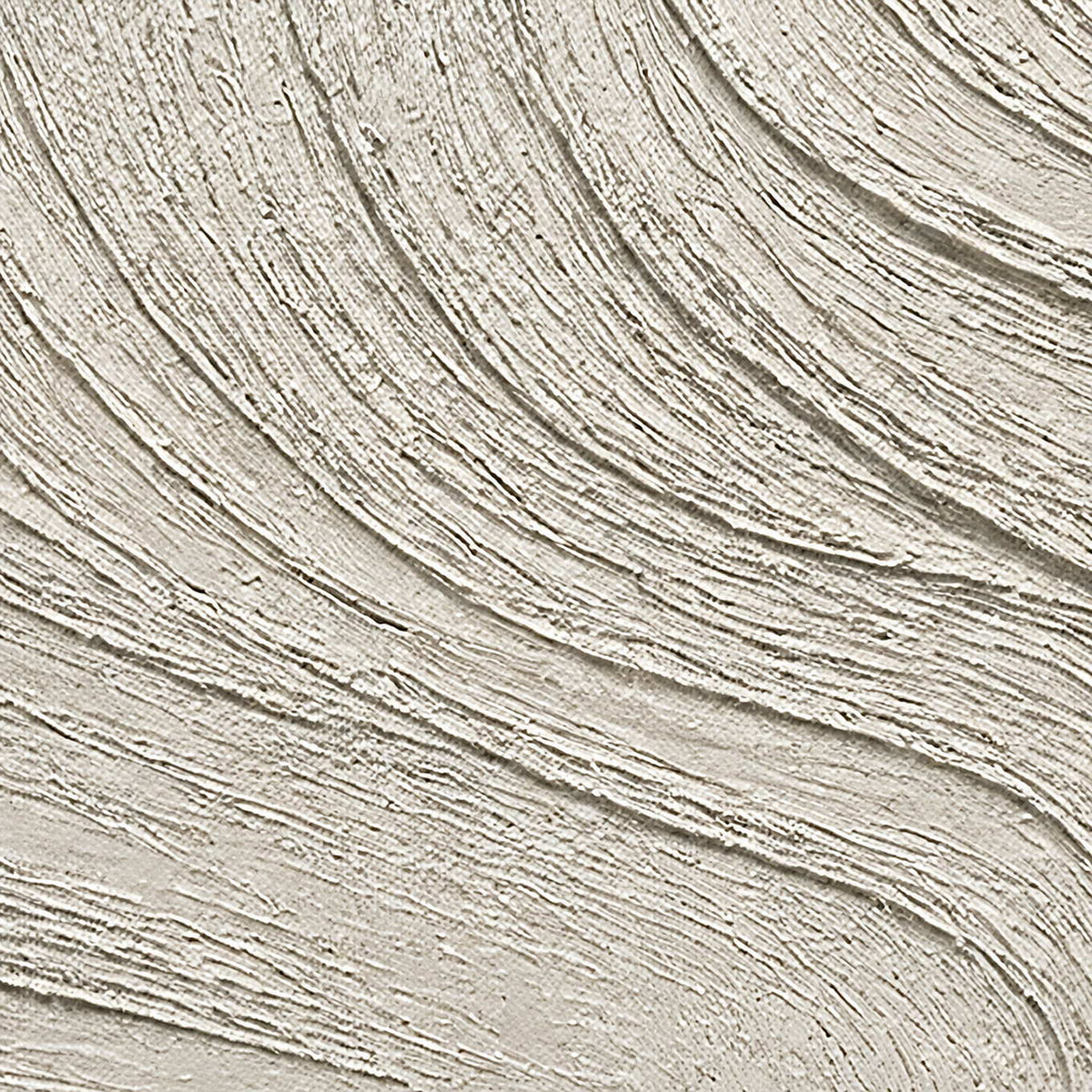 Close-up of flowing hand-worked ridges in chalk white and pale stone.