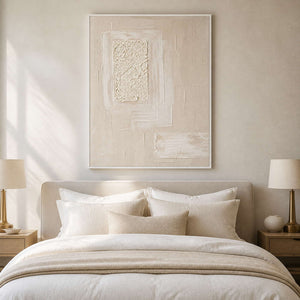 Soft blush and white artwork styled above a peaceful bedroom.