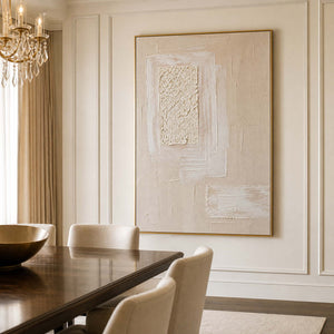 Neutral textured artwork displayed in a refined cream dining room.