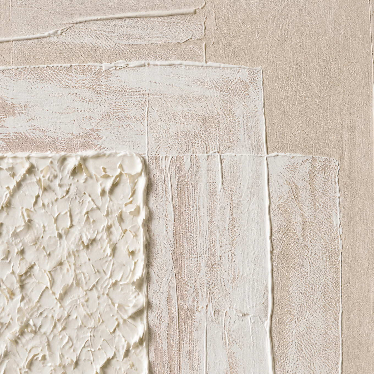 Close-up of raised ivory texture and soft blush layered paint.