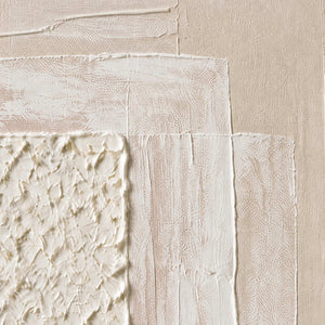 Close-up of raised ivory texture and soft blush layered paint.