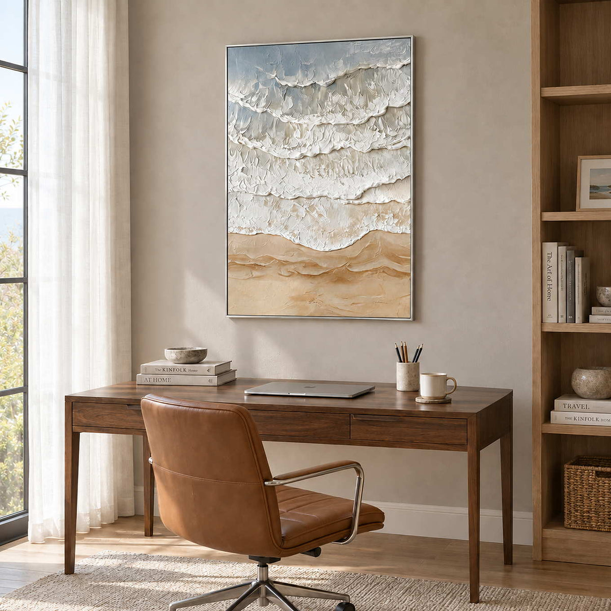 Whispering Tides in a silver frame above a wood desk and brown leather office chair beside shelving.