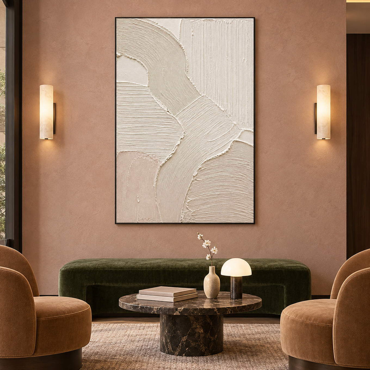 Hand-painted ivory abstract canvas with overlapping raised organic forms, displayed in a hotel lounge in a black frame.
