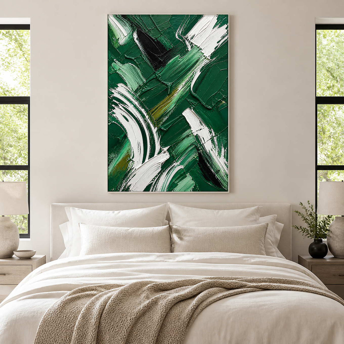 Bold emerald abstract canvas brings graphic movement above a neutral bed.
