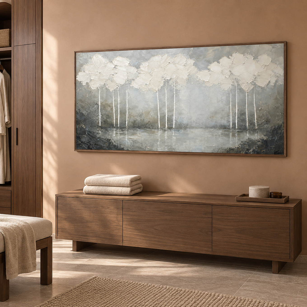 Hand-painted textured landscape wall art in white, pearl gray, and charcoal, displayed in a bathroom dry area in a brown wood frame.