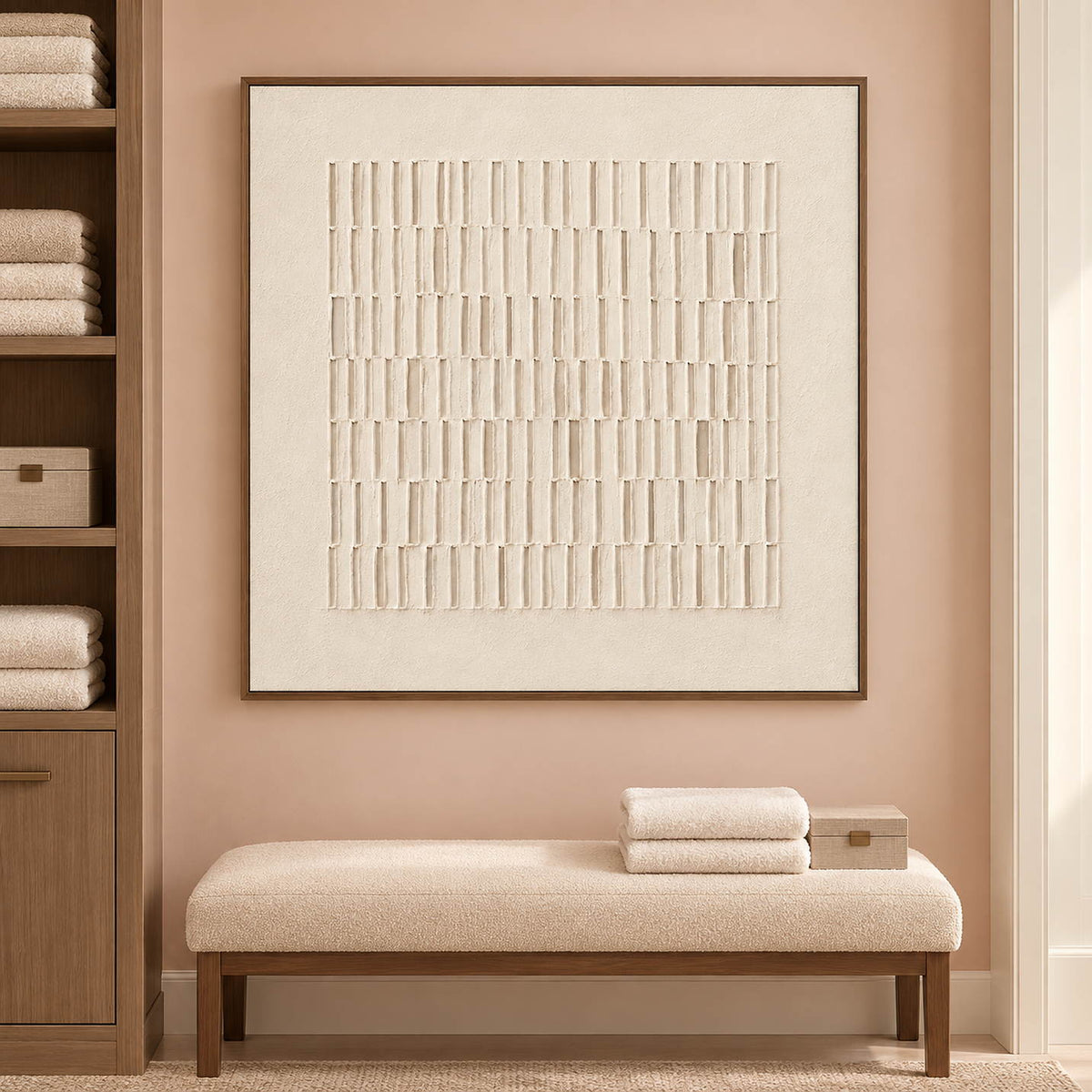 Square ivory relief artwork formed by rows of raised vertical marks, displayed in a bathroom dry area in a brown wood frame.