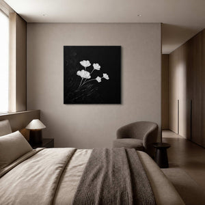 White leaf relief styled in a soft gray-beige bedroom reading area.