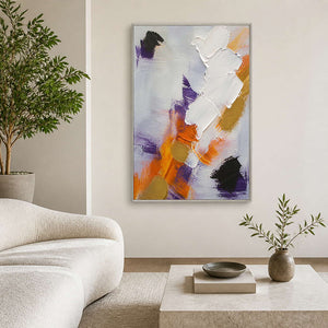 Textured white orange and violet abstract wall art in a bright modern living room.