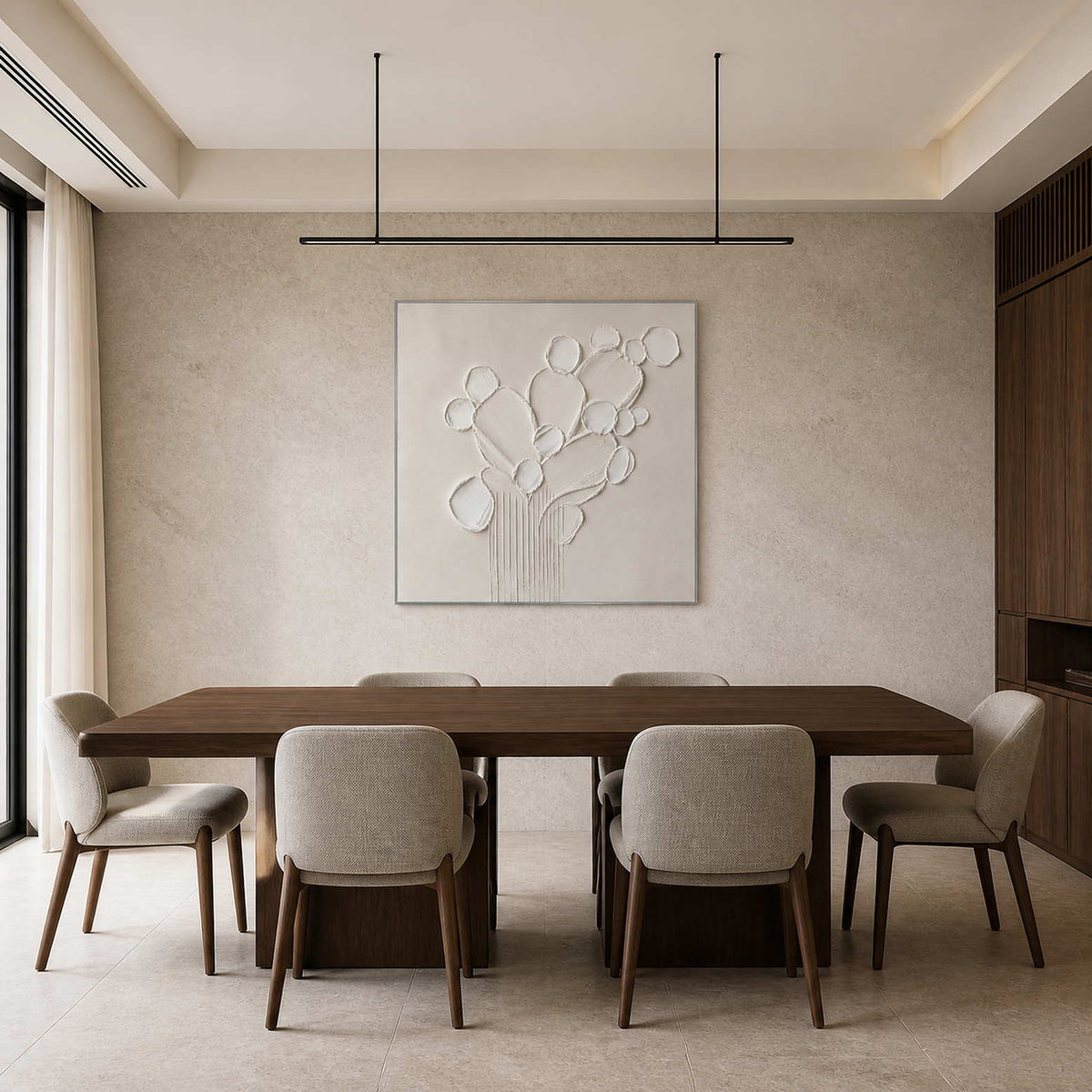 Monochrome botanical relief displayed in a pale gray stone dining room.