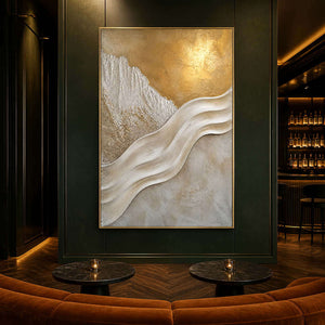 Luminous gold abstract wall art in an emerald hotel lounge.