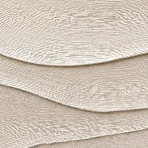 Close-up of fine combed lines across layered ivory relief.