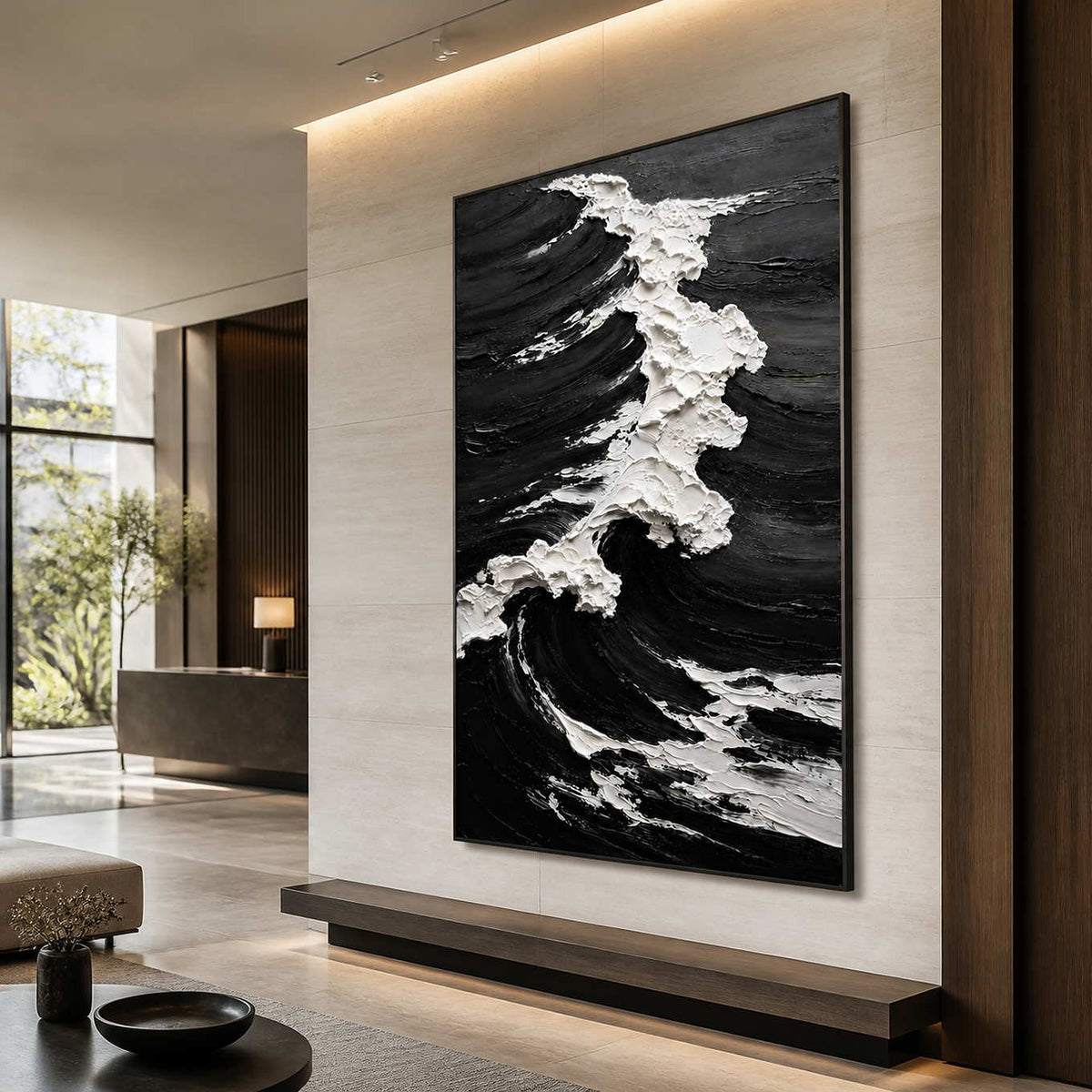 Black framed coastal artwork with rough white foam above a hotel lobby bench.
