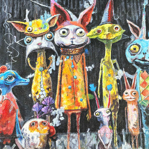 Close-up of wide eyes, pointed ears, orange clothing and colored dots on the central characters.
